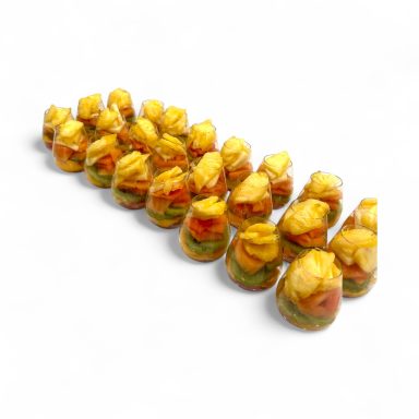 Colorful gelatin desserts shaped like small roses, arranged in a line.