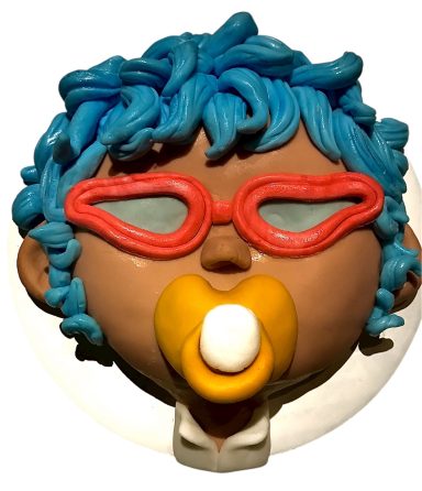 A cartoonish baby head with blue hair, red glasses, and a pacifier.